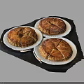 Three Delicious Baked Puff Pastry Tarts Displayed On White Plates Over Dark Tray