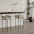 Minimalist Modern Interior Featuring Two Bar Stools Black Counter And Window Plant