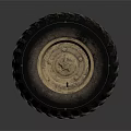 Large Industrial Tire With Deep Tread And Worn Metallic Rim On Dark Background