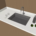 Stainless Steel Kitchen Sink With Running Water Faucet Green Apples Glass Cups On White Countertop