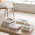 Stacks of Books and Magazines on Wooden Coffee Table With Various Cover Designs
