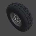 Off Road Vehicle Tire With Deep Tread Pattern And Silver Alloy Rim