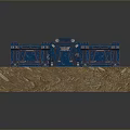 Blue Metal Gate Featuring Intricate Decorative Details On Wooden Display Base