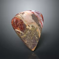 Irregularly Shaped Colorful Natural Stone With Red White Brown Hues And Intricate Polished Texture