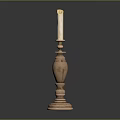 Decorative Brass Candlestick With Tall Design And Lit Candle On Black Surface