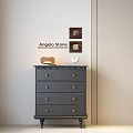 Gray Chest Of Drawers With Gold Knobs And Decorative Items On Light Wall 3d model
