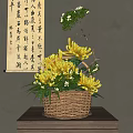Wicker Basket Vase with Yellow Chrysanthemums and Green Leaves on Wooden Table with Calligraphy Scroll Background