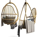 Stylish Rattan Hanging Chair with Blue and Gray Pillows and Cozy Blanket