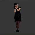 Woman in Black Dress and Stockings Standing with Hand on Cheek Against Gray Background