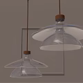 Modern Transparent Glass Petal Pendant Lights with Golden Metal Accents Illuminated Warm Light Grey Wall