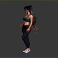 Active Woman in Blue Sports Bra Dark Leggings and White Sneakers Standing on Gray Background