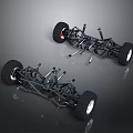 Two Black Toy Car Chassis With Large Wheels And Metal Frame Structure