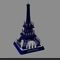 Kinderburg Themed Eiffel Tower Model With Small Figures On Tower Structure Standing On Blue Base