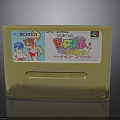 Golden Super Famicom Game Cartridge With Cartoon Characters And Text Labels