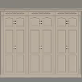 Beige Three Door Wardrobe With Decorative Top And Cabinet Doors On Wooden Floor