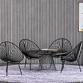 Modern Table And Chair Set With Black Metal Frame Round Glass Top And Striped Wall Rug
