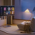 Comfortable Bean Bag Chair In Cozy Living Room With Large Screen TV And Floor Lamp