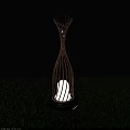 Outdoor Lamp with Branch Like Metal Frame Design and Illuminated White Light in Green Grass