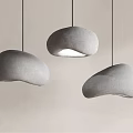 Three Gray Fabric Pendant Lights With Irregular Shape Hanging On Light Colored Wall 3d model