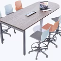 Wooden Conference Table With Laptop Keyboard And Colorful Chairs In Office