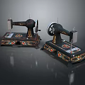 Two Vintage Sewing Machines With Decorative Floral Patterns And Classic Design