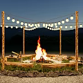 Burning Bonfire At Night With Stone Circle Wooden Posts String Lights And Mountain Background 3d model