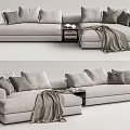 Light Gray Sectional Sofa With Multiple Pillows Side Table Books And Throw Blanket 3d model