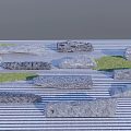 Natural Rockery Stones With Various Shapes And Grass In Garden Landscape