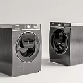 Two Modern Front Loading Washing Machines With Stainless Steel Finish And Sleek Design