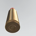 Detailed Golden Bullet With Red Tip Isolated On Light Background