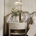 Elegant Marble Bedside Table with Vase Green Plant and Decorative Item in Modern Bedroom