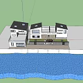 Modern Boutique Guesthouse Building With White Exterior Large Windows Outdoor Seating And Lawn