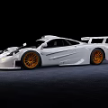 White High Performance Sports Car With Orange Alloy Wheels Sleek Aerodynamic Body And Rear Spoiler