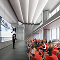 Modern Conference Room With Presenter Audience Red Seating Large Screen And Windows 3d model