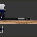 Durable Blue Bench Vise With Claw Hammer Securely Fixed On Wooden Workbench 3d model