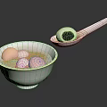 Traditional Chinese Tangyuan in White Bowl with Soup Pink White and Black Balls and Spoon
