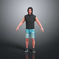 Man In Hooded Sleeveless Top And Distressed Denim Shorts With Sneakers Standing Against Gray Background
