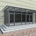 Modern Building Entrance Featuring Glass Doors Curtain Wall And Red Brick Pavement