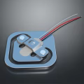 Blue Square Electronic Component Featuring Metal Parts And Red Black Wires On Dark Background