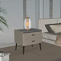 Gray Modern Nightstand With Two Drawers Golden Table Lamp And Sunlight Through Blinds