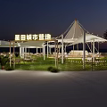 Scenic Circular Photo Check In Spot With Large White Tent Grass Lawn And Palm Trees