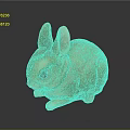 Small Orange Rabbit Figurine With Big Ears Black Eyes And Shiny Surface On Dark Background