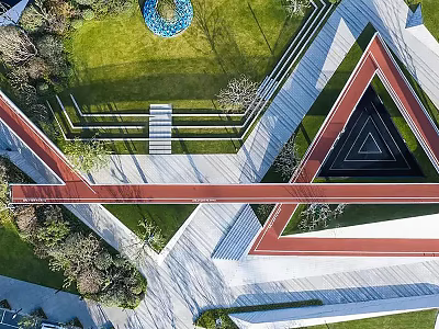 Geometric Park Landscape With Red Black Triangular Structures Green Lawn Pathways And Trees 3d model