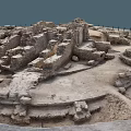 Ancient Stone Ruins With Circular Stone Walls And Scattered Blocks In Archaeological Site
