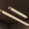 Two Modern Linear Brass Pendant Lights Hanging From Dark Ceiling With Warm Glowing Effect 3d model