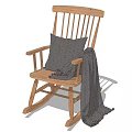 Cozy Wooden Rocking Chair with Gray Cushion and Soft Comfortable Blanket