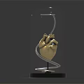 Golden Heart Model Medical Device With Glass Dome And Black Base