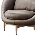 Modern Gray Leather Armchair with Wooden Legs and Comfortable Seating Design