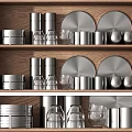 Stainless Steel And Glass Tableware Set With Plates Cups On Wooden Shelf