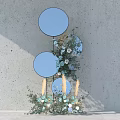 Photo Spot With Blue Circular Mirrors Floral Arrangements And Green Plants On Gray Wall